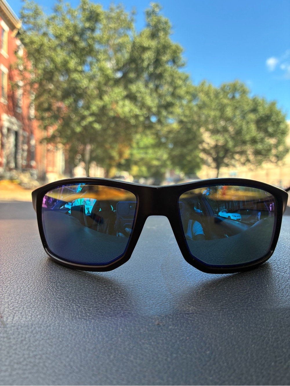 Oakley Black Frame Sunglasses with Blue Mirrored Lenses
